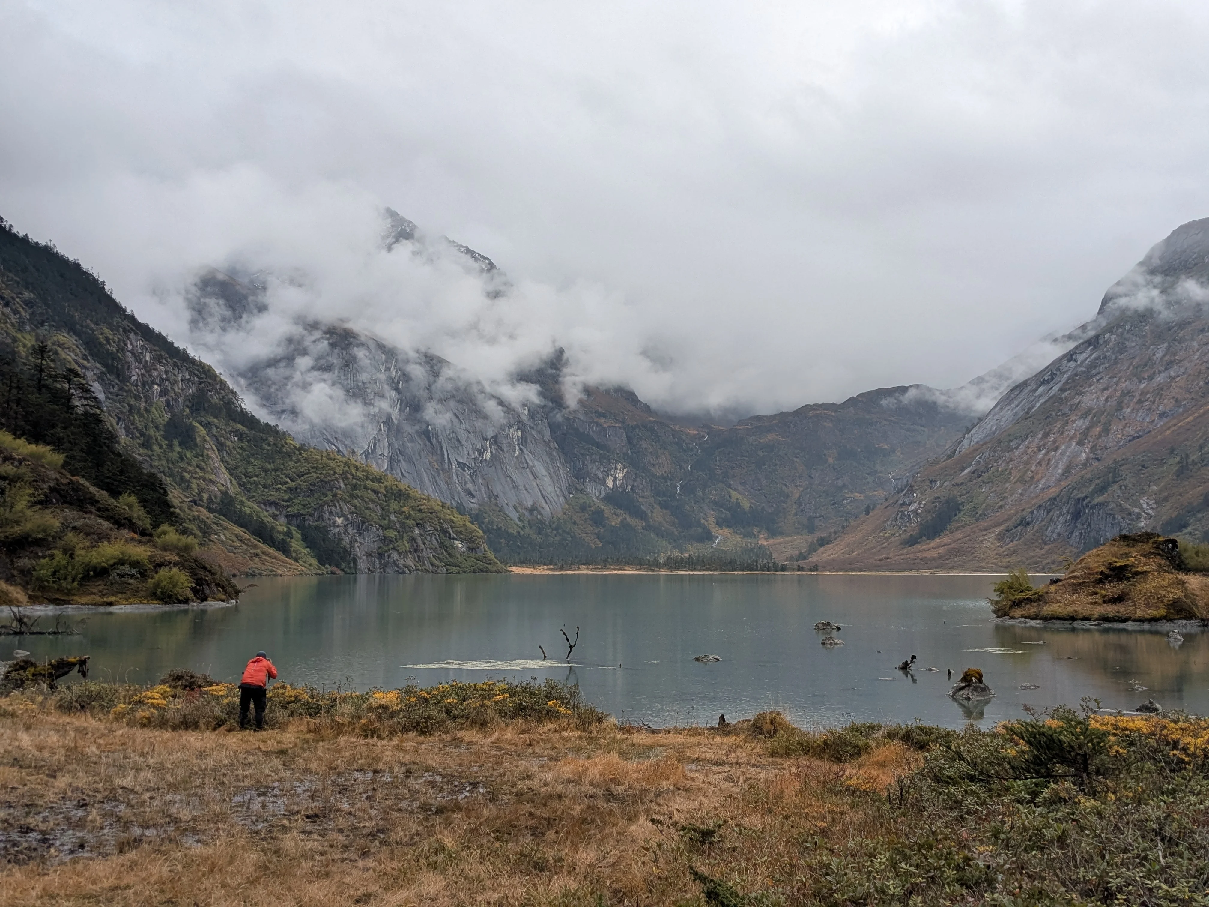 Pristine alpine lake 4 reflecting forest and mountains in Aeyo Valley